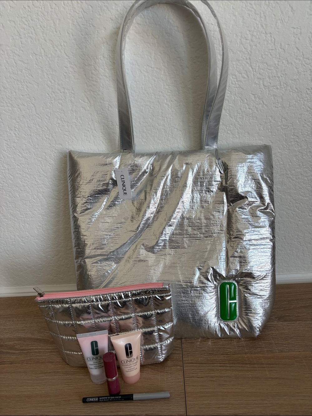 Clinique Silver Padded Tote with Matching Cosmetic Pouch and Never Used Products